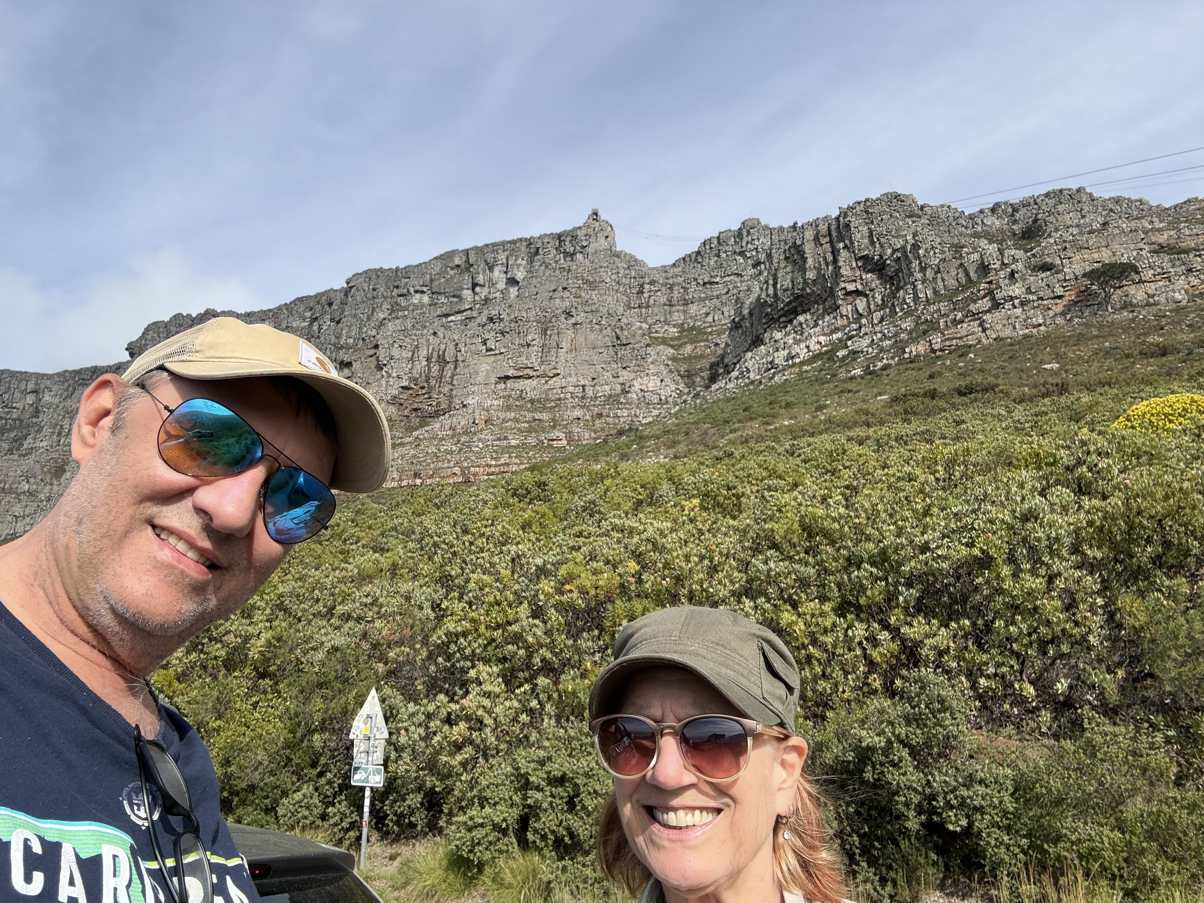 On the mountain. Table Mountain behind us, doing the thing it does.