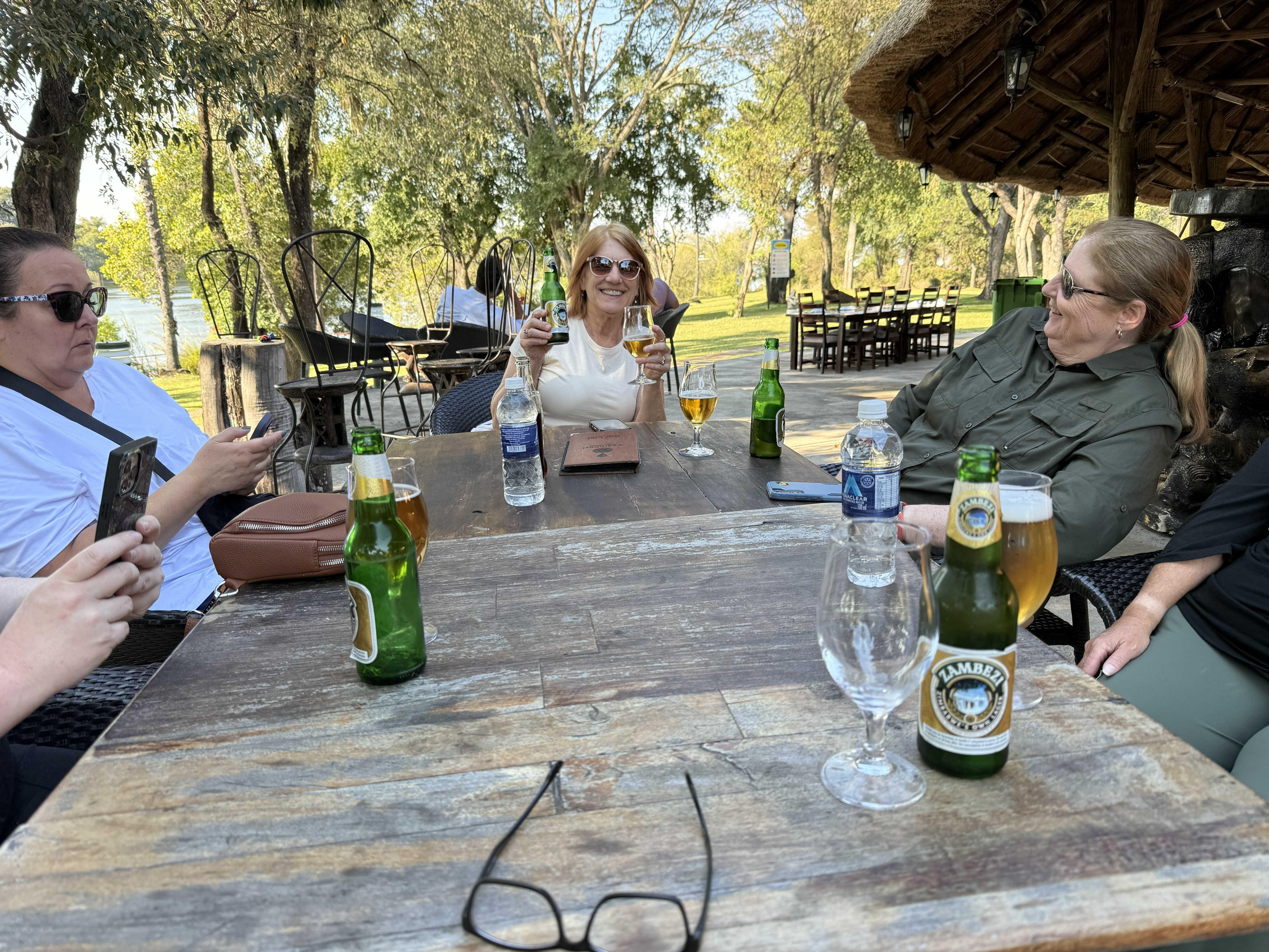 First beer in Zimbabwe, on the bank of the Zambezi. Somewhere behind this photograph a monkey is deciding whether to rob us.