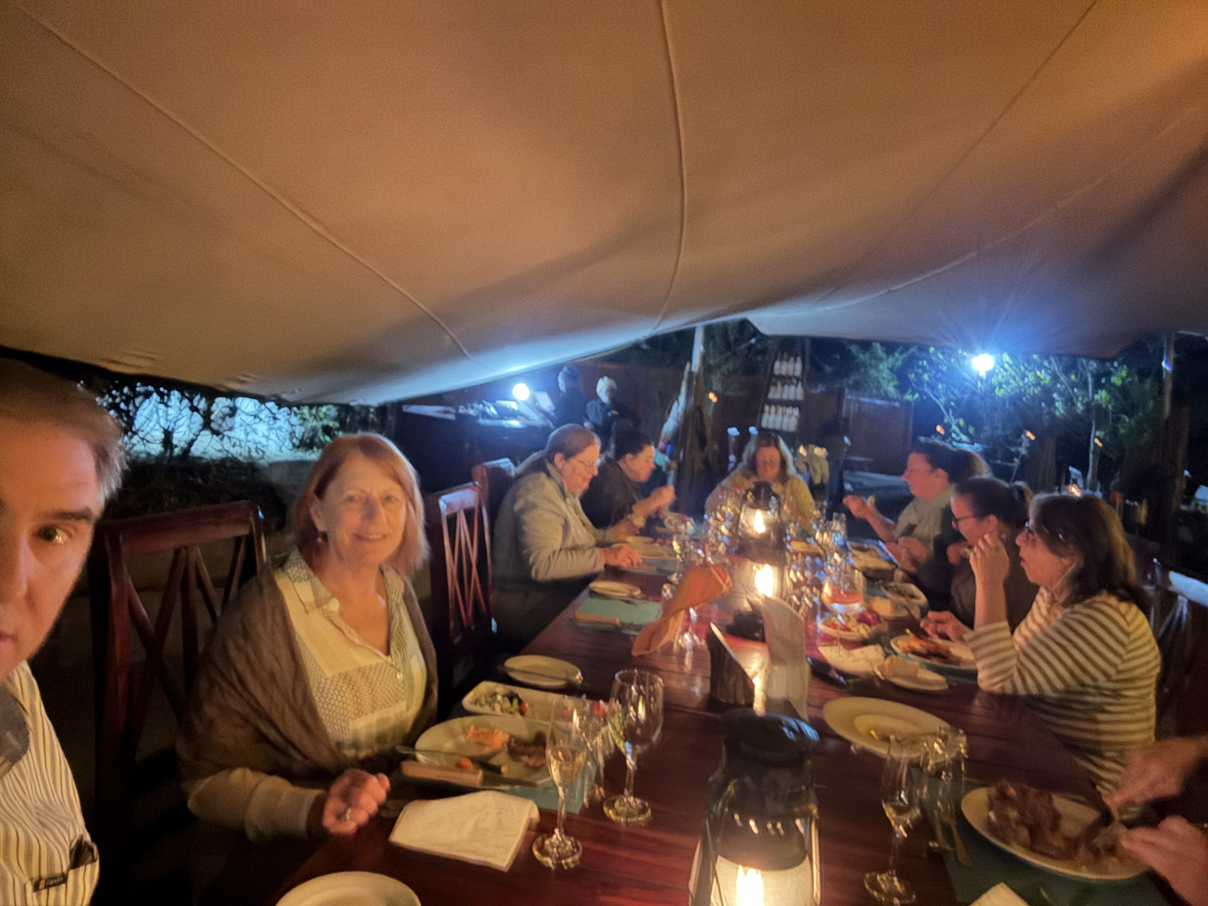 Dinner that night: the group around one long table off in another part of the lodge, candles and wine and the particular good tiredness of a day spent outdoors. We had crossed a bo