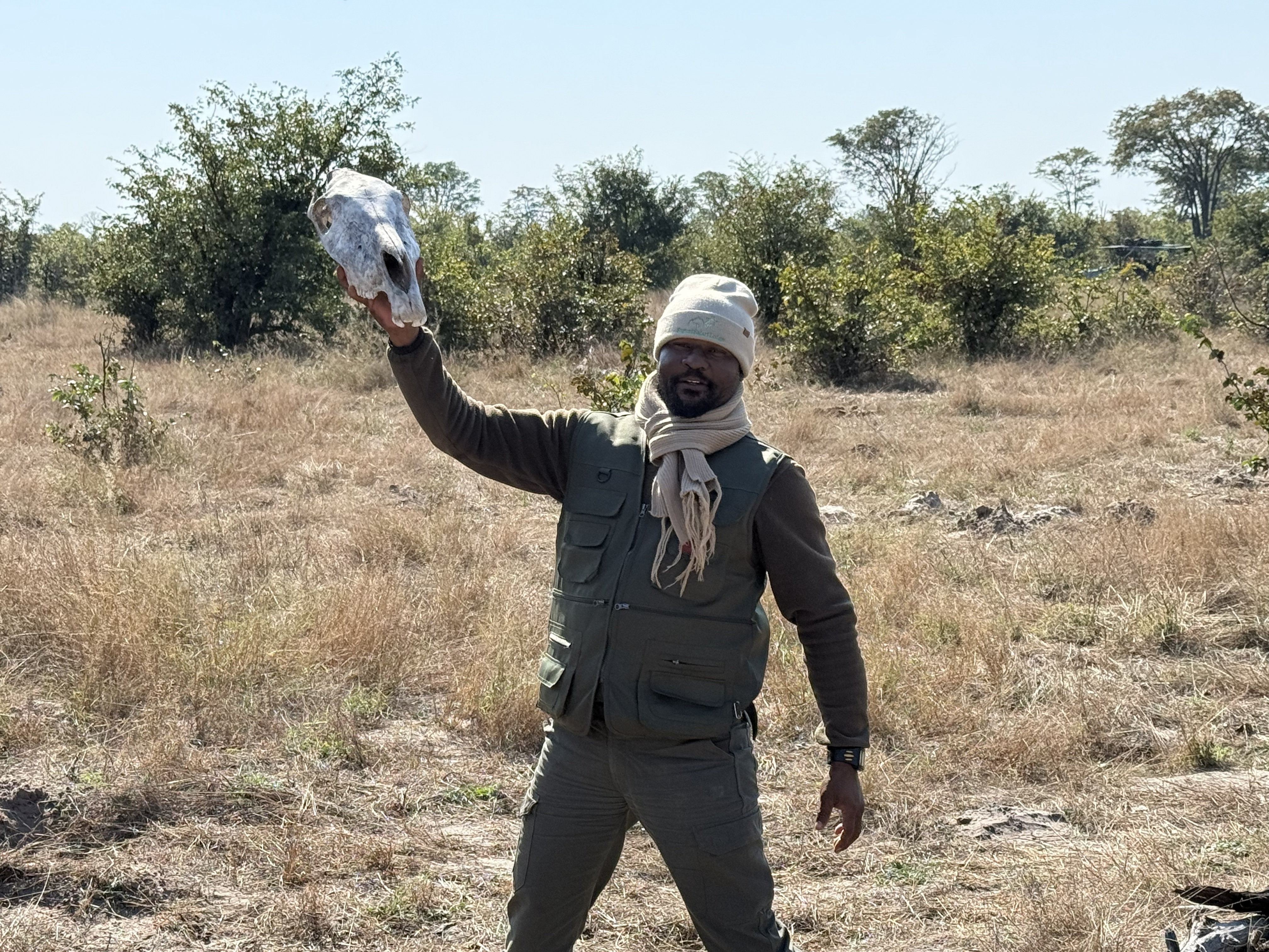 Obert with a zebra skull. The guides find these things; the guests want to take them home.