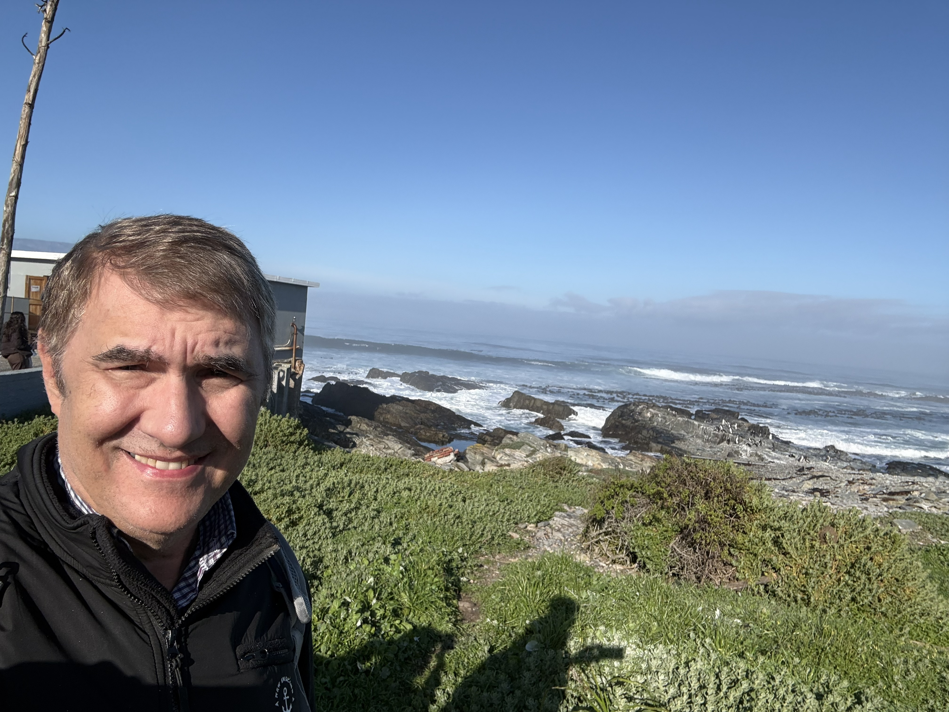 First landfall: the low, wind-scoured shore of Robben Island, with nothing soft about it.