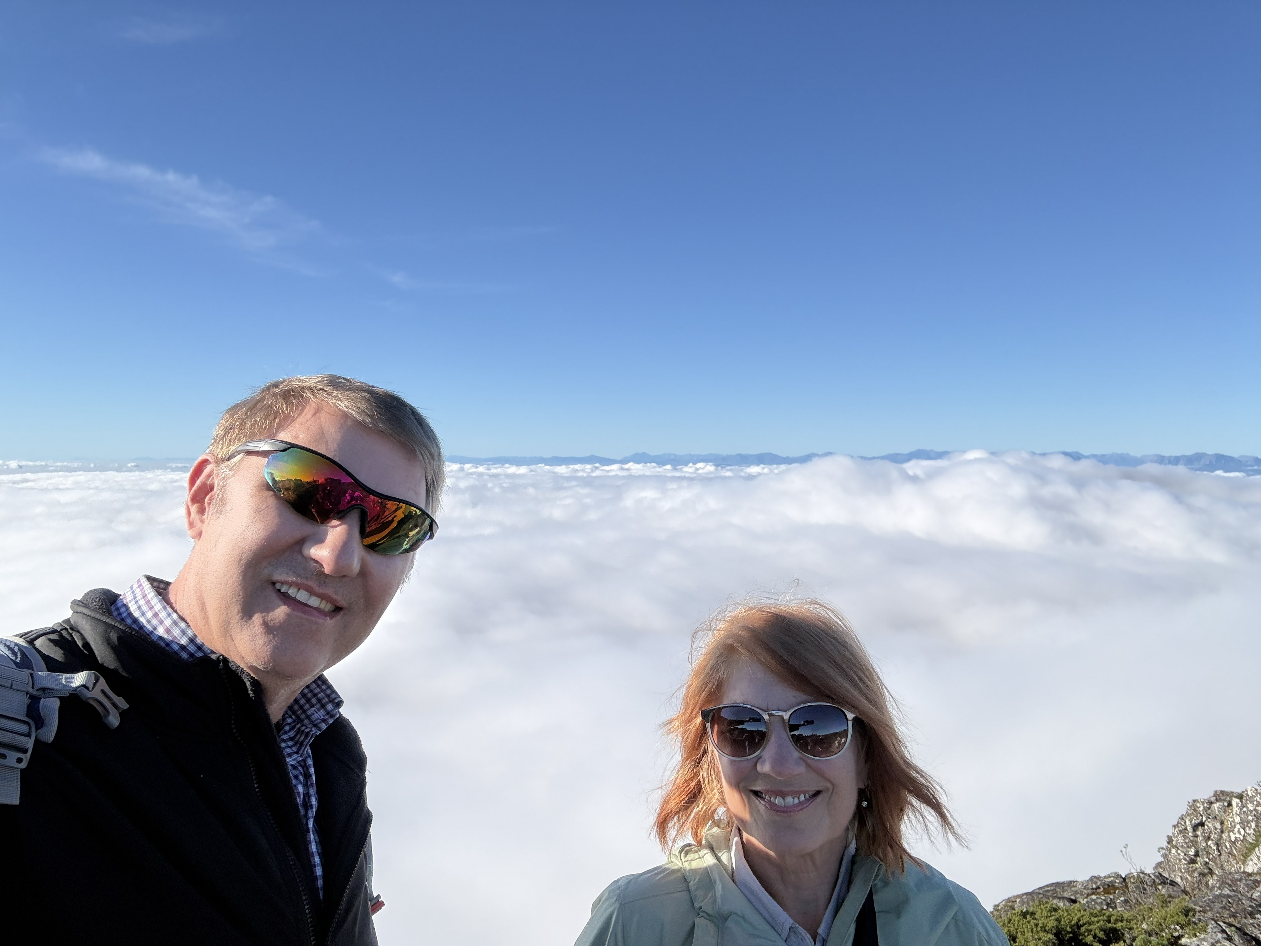 At the top, above the cloud — Bonnie and me with a sea of white below and the day's earlier sorrows a long way down through it.