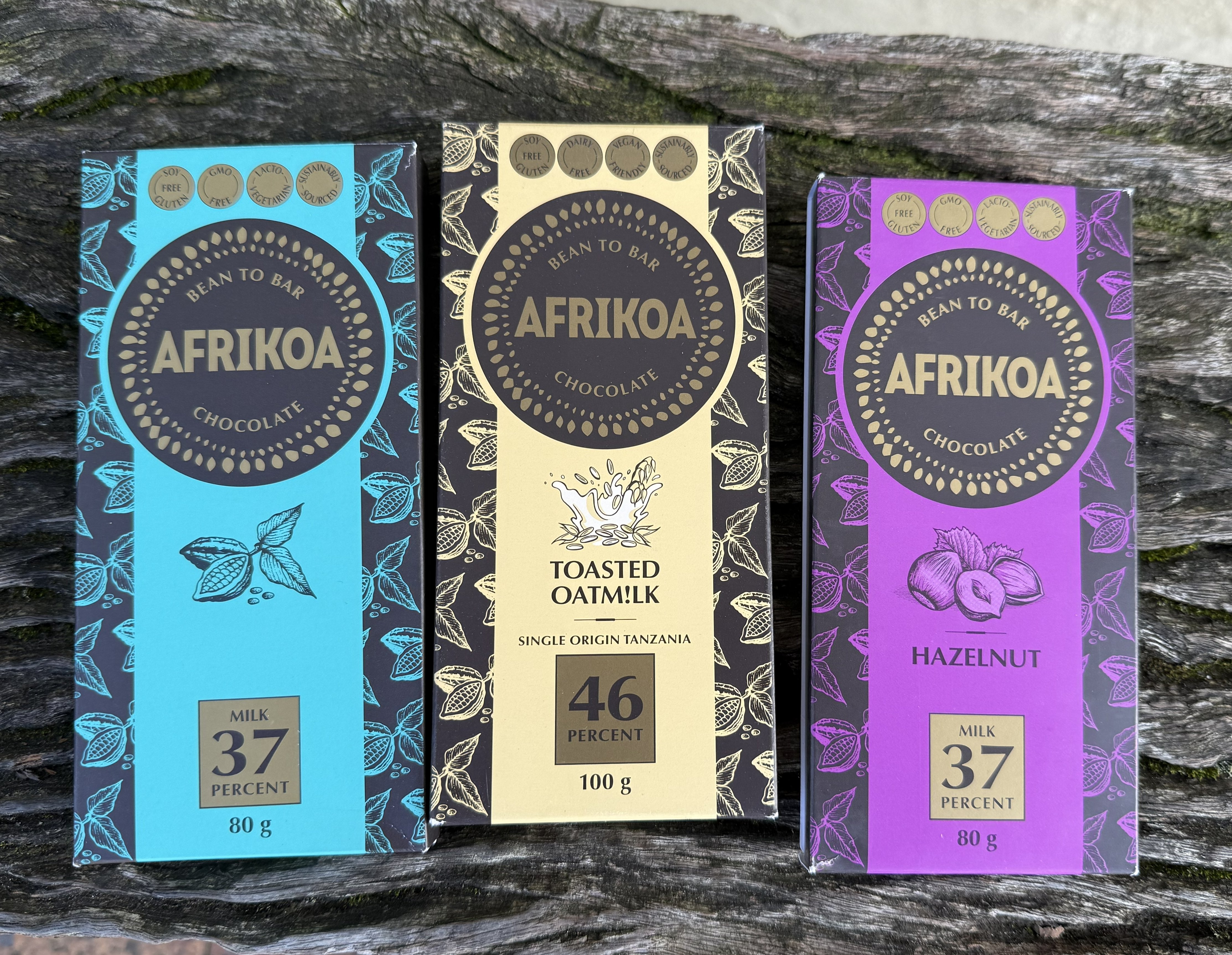 The haul: three bars of Afrikoa, photographed on a tree trunk because the light was good and I had become that sort of tourist.