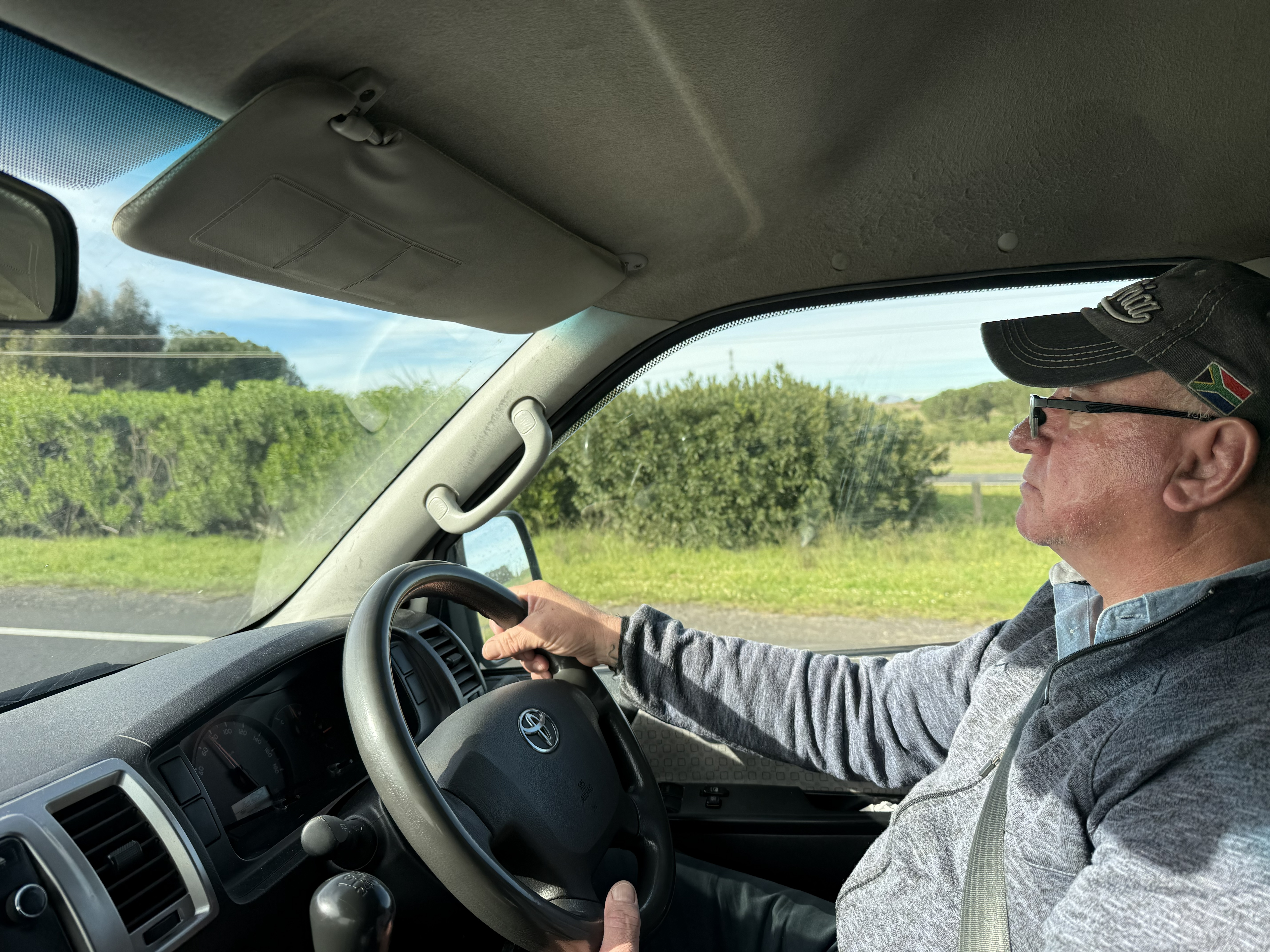 Eric at the wheel, and me still riding up front — a courtesy that had, by now, become simply the way things were.