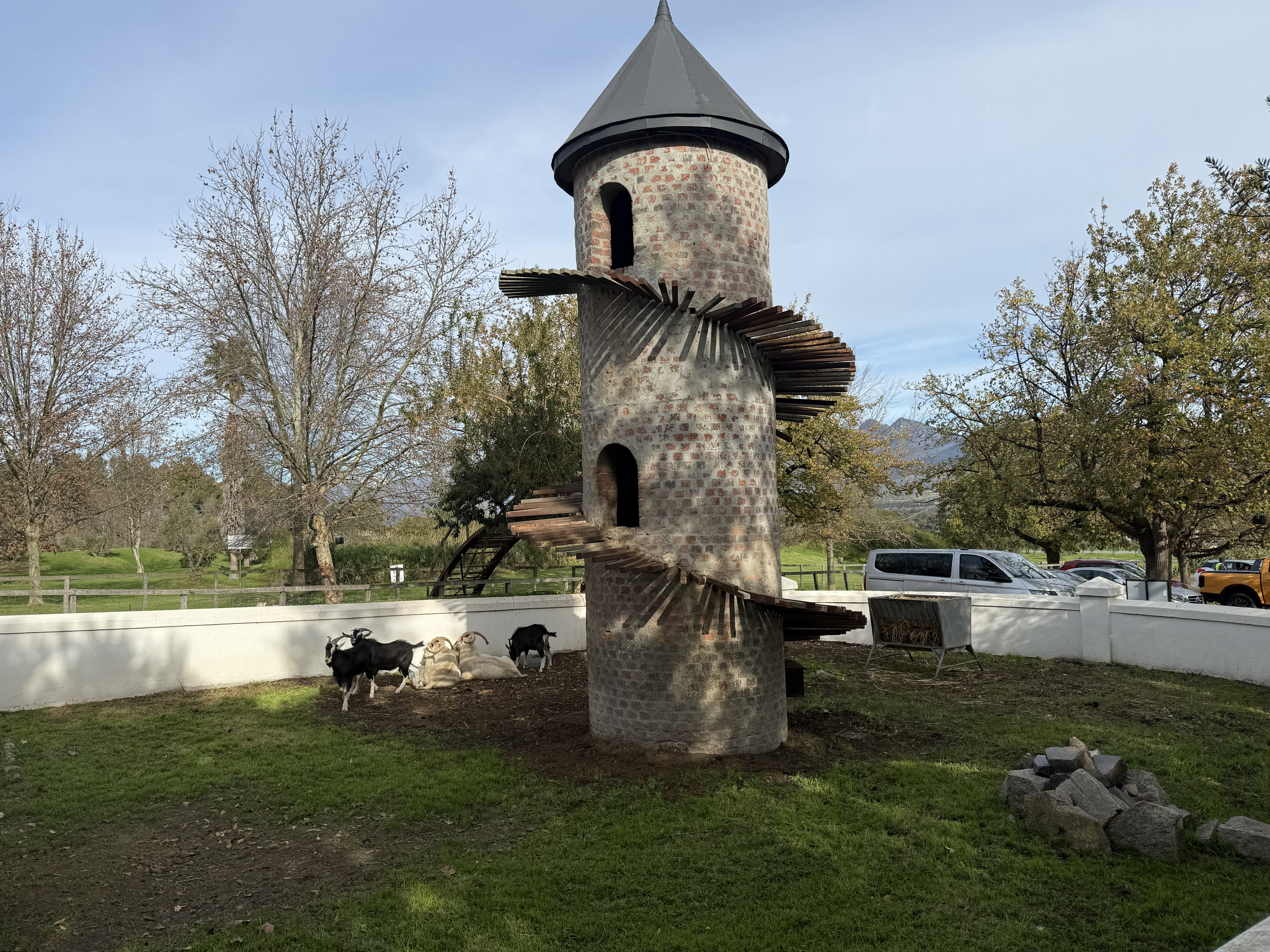 And the goats afterwards. That is the Goat Tower — brick, two storeys, with a wooden spiral ramp winding up the outside, built in 1981 after Charles Back saw one like it in Portuga