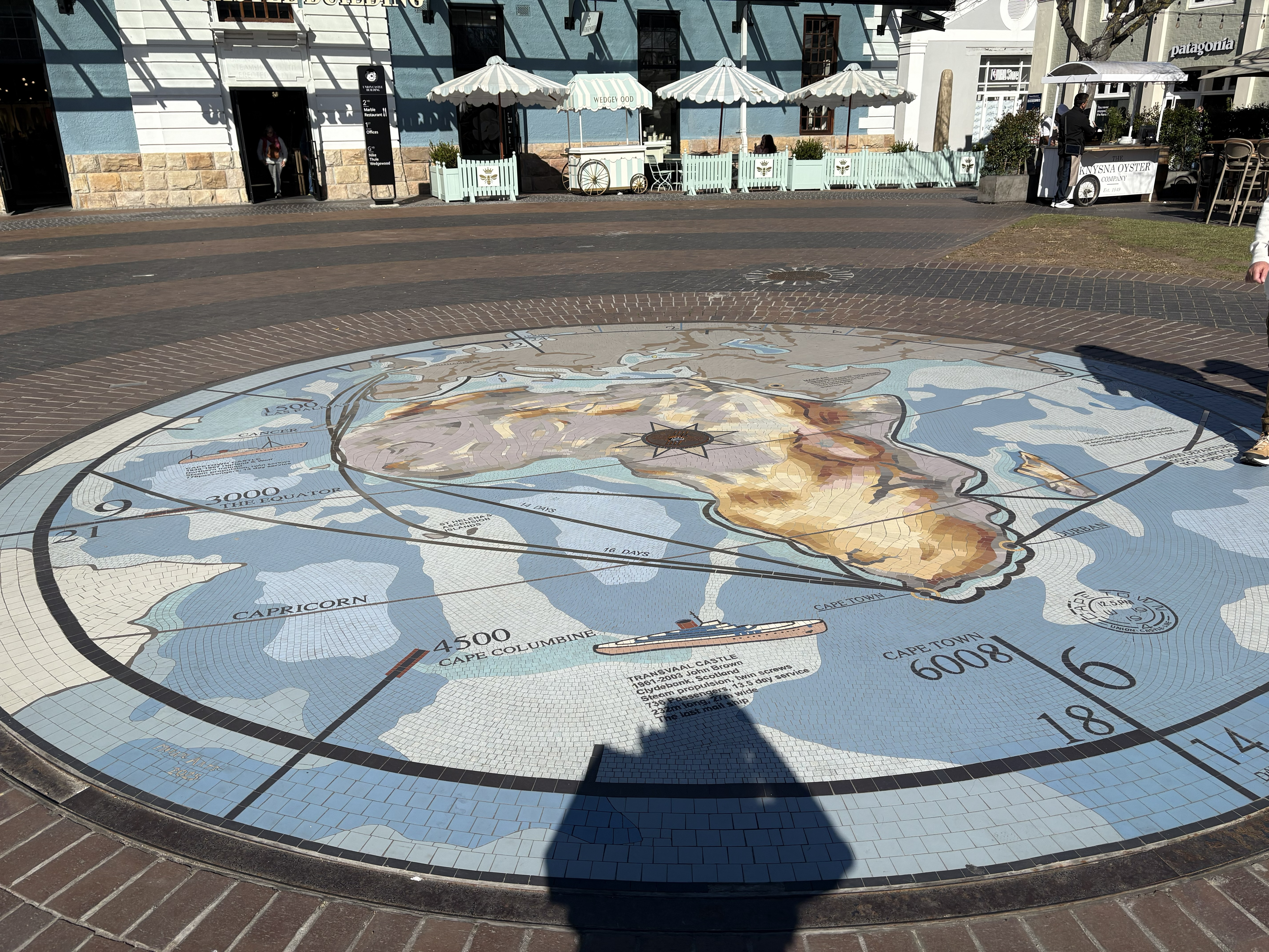 And the great compass and world map set into the paving, with the harbour and the mountain all round it. A good last image of the place: a map of everywhere, on the ground, at the